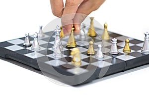 Hand moving small chess on white background.