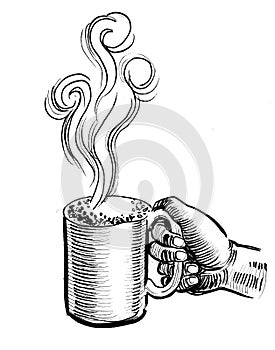 Hand with a mug of coffee