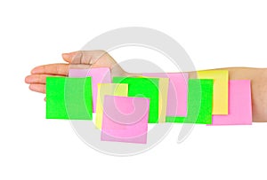 Hand and multicolored note paper
