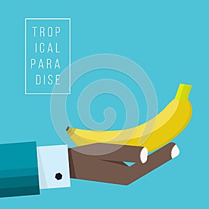 Hand of negroid businessman holds banana icon