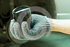 Hand with New oil Filter.