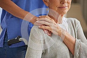 Hand, nurse and elderly woman patient with disability holding hands homecare worker for empathy, kindness and healthcare