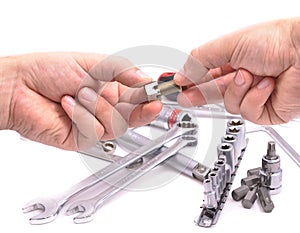 Hand with a nut and bolt