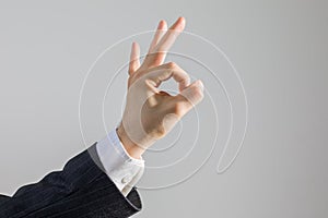 Hand OK Sign of Businessman in Suit as Concept of Agreement, Isolated on White, Studio Shot