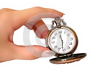 Hand with old golden pocket watch