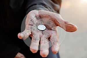 Hand old man begging for money because of the hunger vintage tone