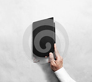 Hand open blank black book cover mock up template.