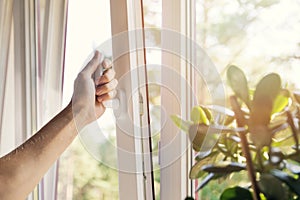 hand open plastic pvc window at home