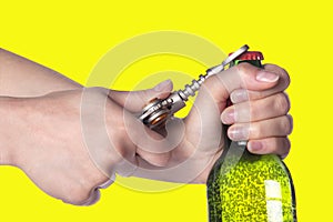 Hand opening beer bottle with metal opener