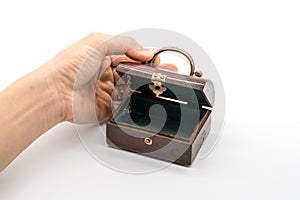 Hand opening vintage luxury wooden box with gold lock and handle