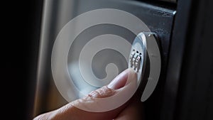 The hand opens the coded lock of the safe. 4k. Slow motion.