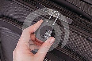 Hand opens suitcase combination lock