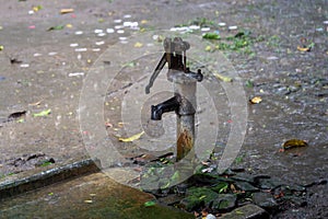 Hand operated water pump, rusted and forgotten