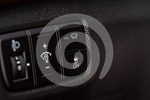 Hand operating ESP electronic stability program control close up view.