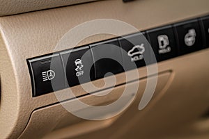 Hand operating ESP electronic stability program control close up view.