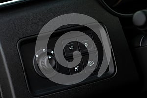 Hand operating ESP electronic stability program control close up view.