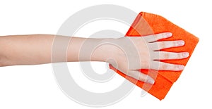 Hand with orange cleaning rag isolated on white