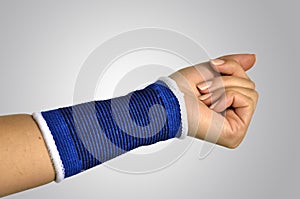 Hand with a orthopedic wrist brace photo