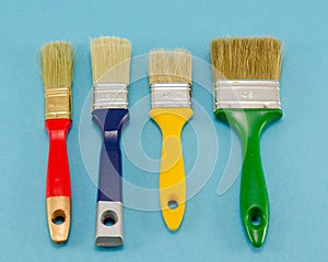 Hand paint brush color different size on blue