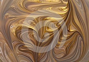 Hand painted background with mixed liquid blue and golden paints. Abstract fluid acrylic painting. Modern art. Marbled.