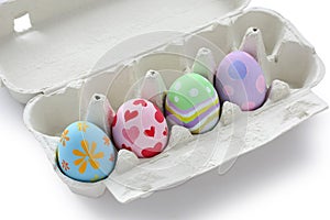 Hand painted easter eggs in egg box