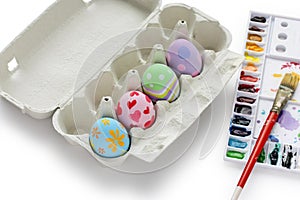 Hand painted easter eggs in egg box