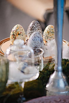 Hand painted easter eggs among other objects out of focus