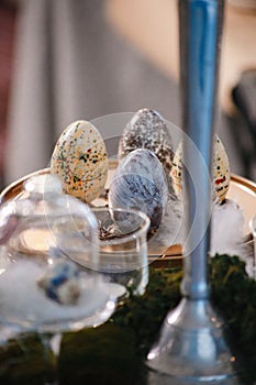 Hand painted easter eggs among other objects out of focus