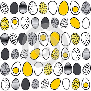 Hand painted eggs in rows yellow gray Easter pattern on white