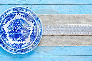 Hand painted plate on wooden background