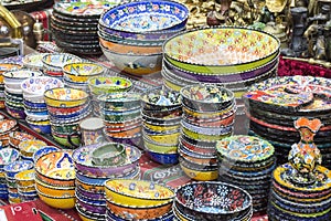 Hand painted Traditional Omani utensils kept in stack inside a Souq for sale to tourists.