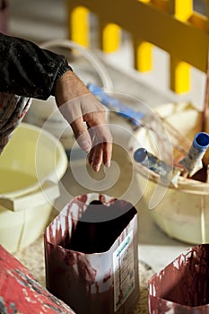 Hand on painter with colors