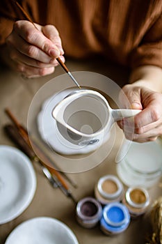 Hand-painting homemade ceramic dishes