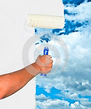 Hand painting sky on white wall