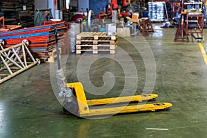 Hand pallet truck jack in factory warehouse. Hydraulic hand pallet jacks. Pallet truck with empty