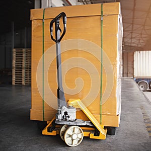 Hand Pallet Truck with Packaging Boxes Stacked on Plastic Pallet. Supply Chain. Cargo Shipment Boxes. Distribution. Supplies