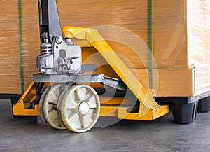 Hand pallet truck with pallet goods. Cargo export, shipment