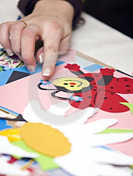 Hand and paper cutouts