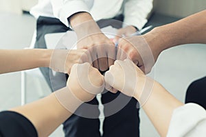 Hand partnership business team giving Fist Bump after complete d