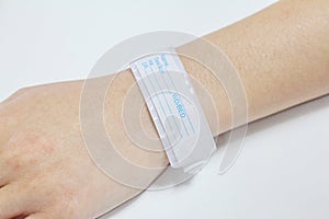 Hand with patient identification bracelet