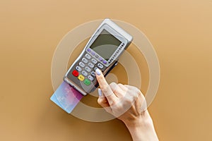 Hand paying by card with pos payment terminal. Payment transactions concept