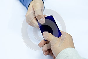 Hand paying credit card with staff cashier