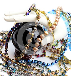 Hand with pearls, beads and crystal ball