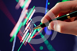 Hand and pen pointer, chart