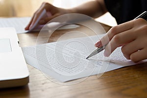 Hand with Pen Proofreading photo