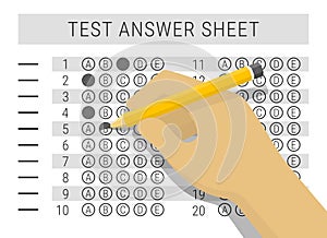 Hand with pencil filling out answers on exam test answer sheet