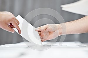 Hand of a person casting a vote