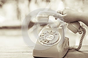 Hand pick up old day phone or rotary telephone