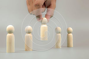 Hand picked a people wood doll concepts human resources