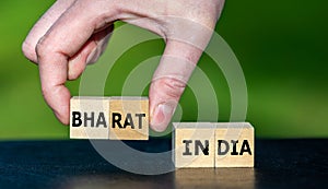 Hand pics cubes with the name Bharat instead of India. Symbol for the discussion how to name India photo